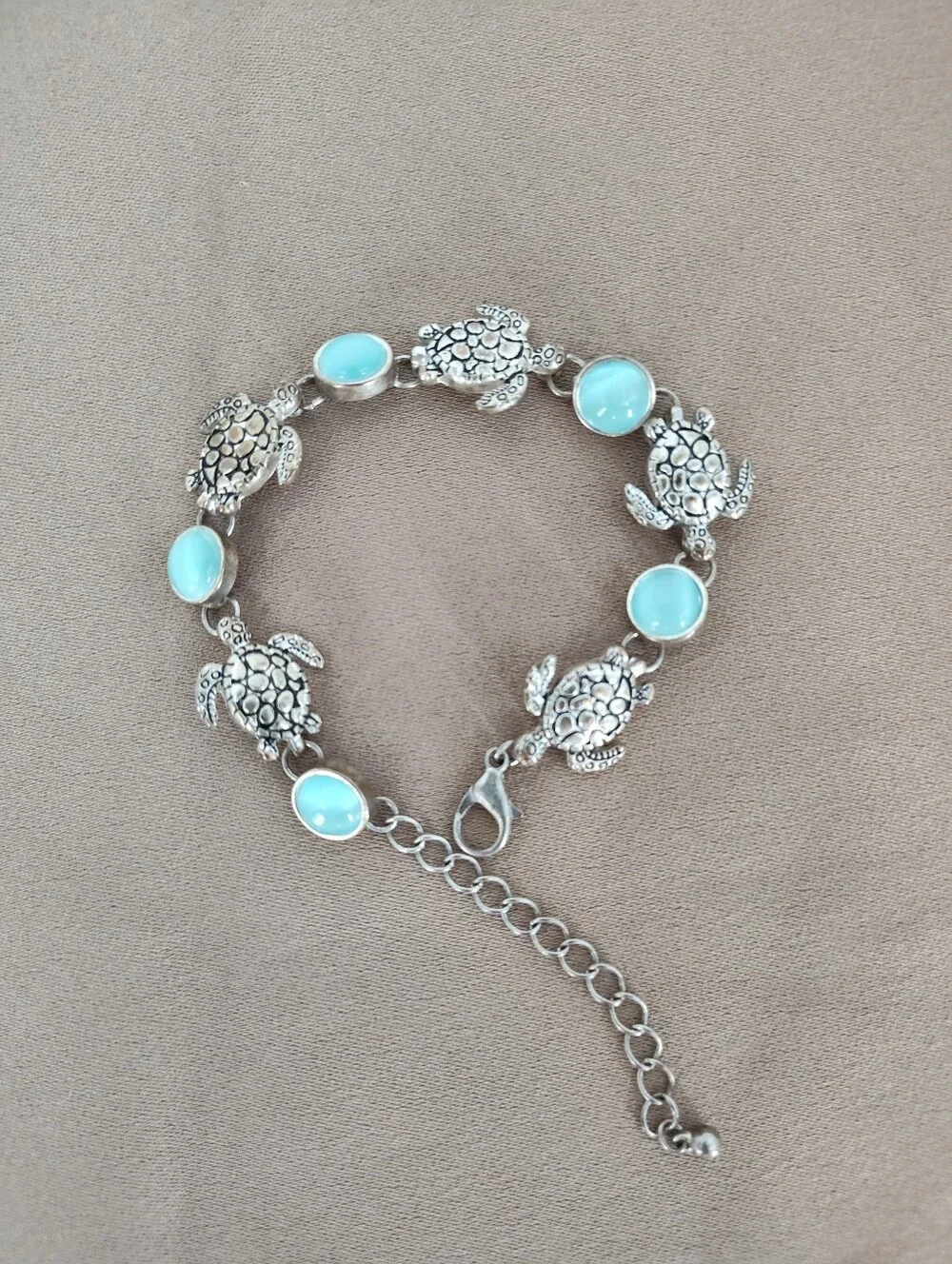 Silver Tone Turtle Link Bracelet with Light Blue Cabochons